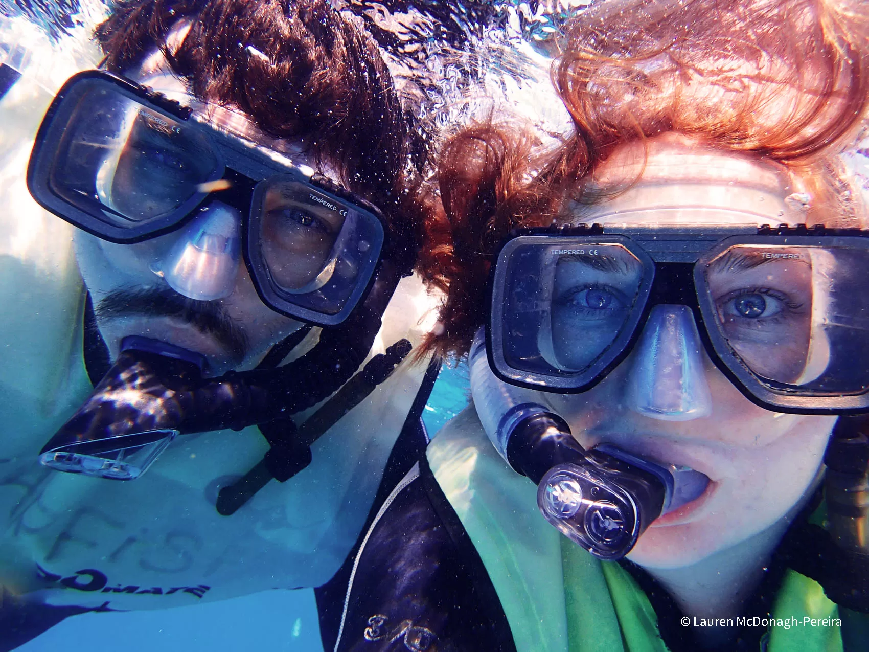 An underwater selfie of a couple snorkeling in the Florida Keys