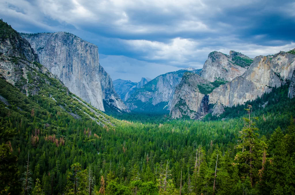 A ohotograph of a cloudy sky over the famous Tunnel View of Yosemite National Park.