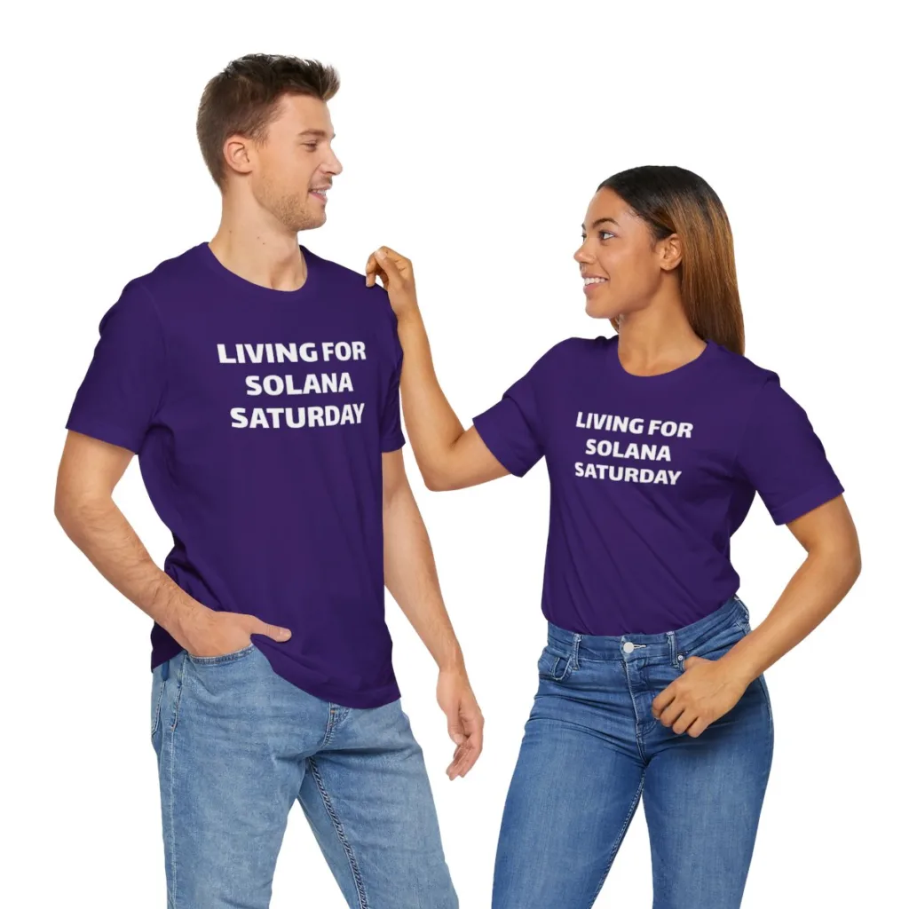 Two people wearing purple tshirts that saying "Living for Solana Saturdays"