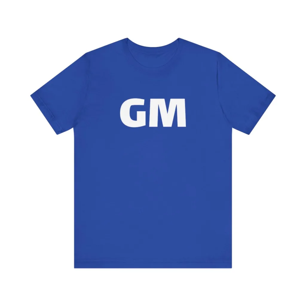 A blue shirt that says GM on the front and GN on the back. 