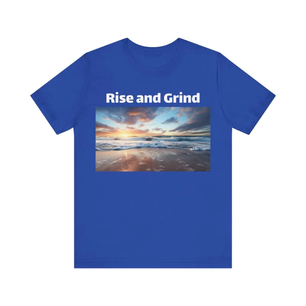 Blue "Rise and Grind" Tshirt with the image of a beach sunrise. 